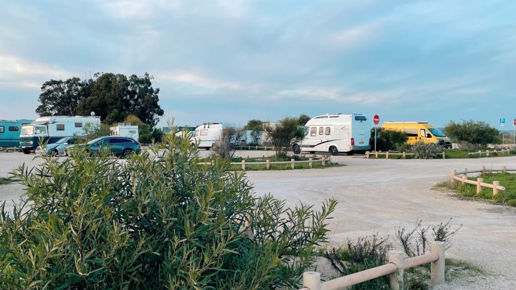 Free parking for campers to stand with lots of other motorhomes 